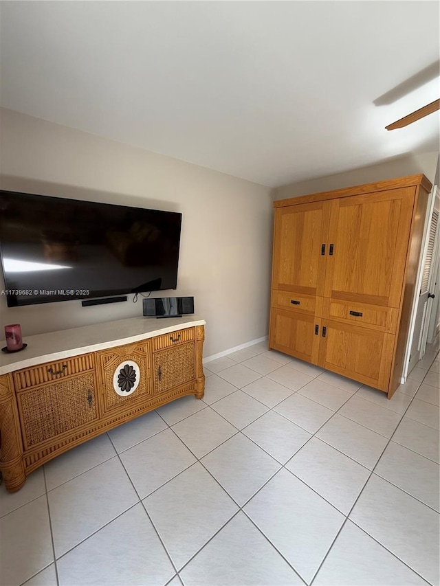 unfurnished living room with light tile patterned floors