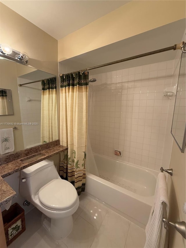 bathroom featuring shower / tub combo with curtain, tile patterned flooring, and toilet