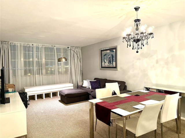 carpeted dining room featuring a notable chandelier