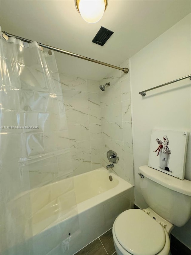 bathroom with shower / tub combo with curtain and toilet