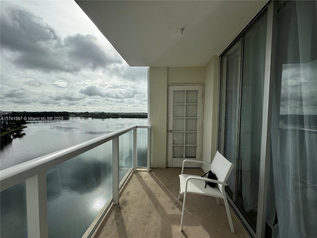 balcony featuring a water view