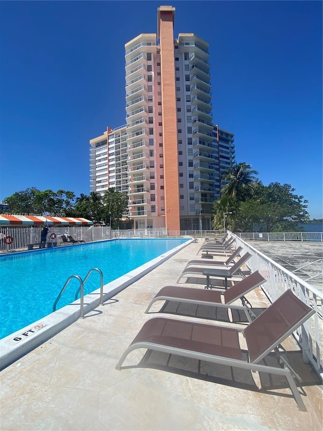 view of swimming pool with a patio