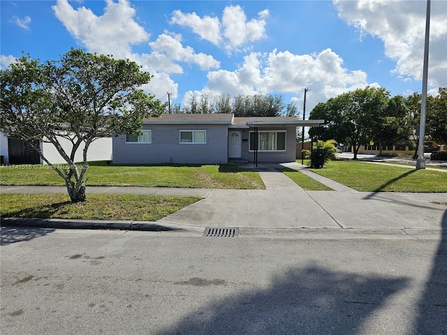 ranch-style house featuring a front lawn