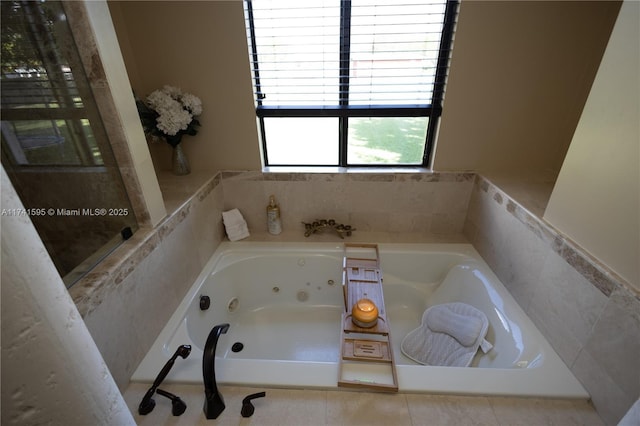 bathroom with tiled bath