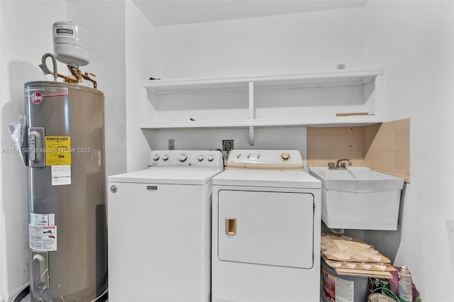 washroom featuring water heater, sink, and independent washer and dryer