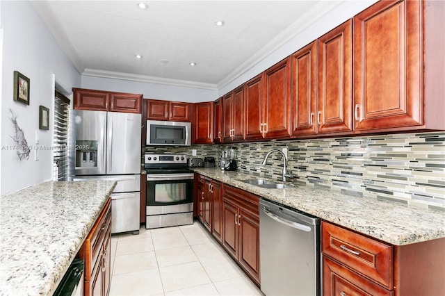 kitchen with appliances with stainless steel finishes, sink, backsplash, light tile patterned floors, and light stone counters