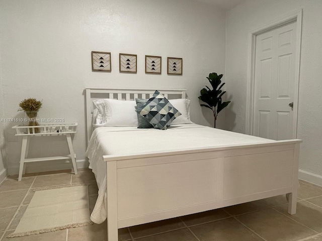 bedroom featuring dark tile patterned floors