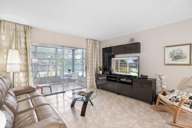 living room with plenty of natural light and light tile patterned floors