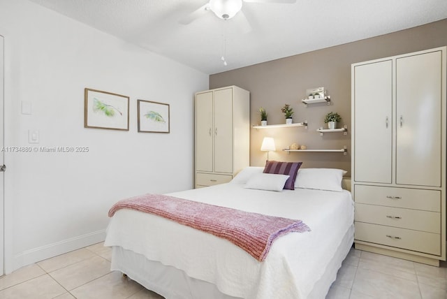 tiled bedroom with ceiling fan