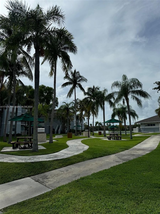 view of home's community featuring a yard and a playground