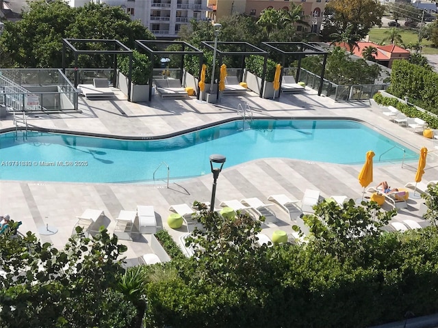 view of swimming pool with a patio area