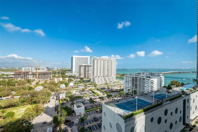 birds eye view of property with a view of city and a water view