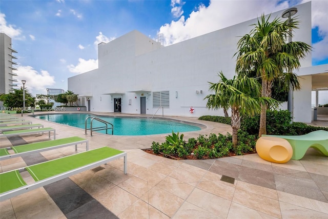 community pool with a patio