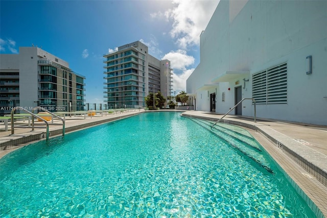 pool with a patio area