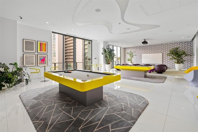 playroom with tile patterned floors, billiards, floor to ceiling windows, and recessed lighting