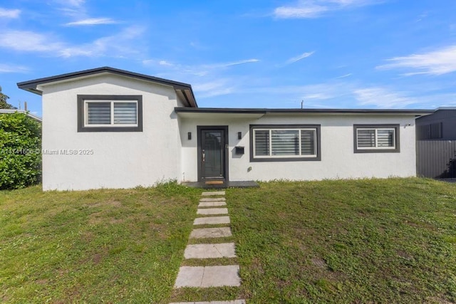 view of front of house with a front lawn