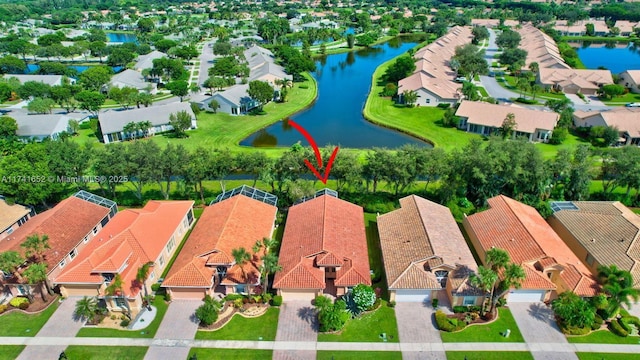 aerial view with a water view and a residential view