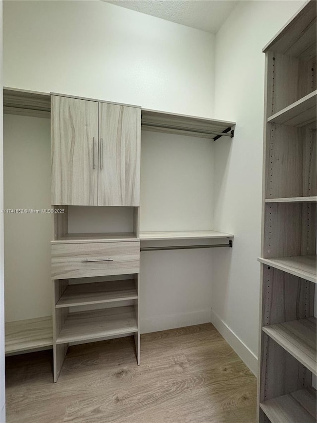 walk in closet featuring light wood-type flooring