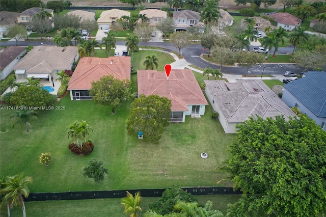 birds eye view of property with a residential view