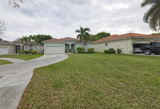 mediterranean / spanish-style house featuring a garage, concrete driveway, a tiled roof, a front lawn, and stucco siding