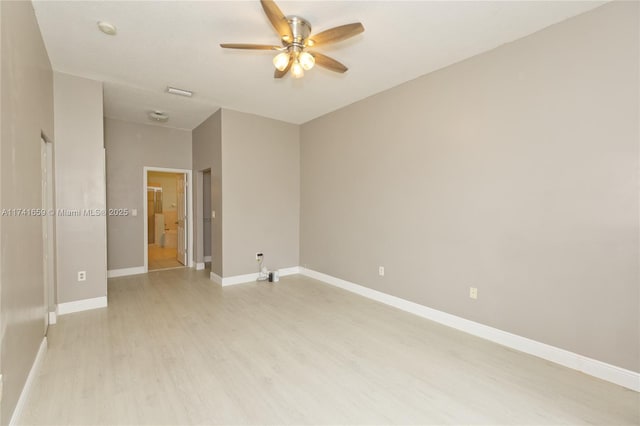 unfurnished room with baseboards, ceiling fan, and light wood finished floors