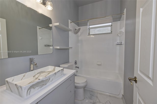 bathroom featuring shower / washtub combination, marble finish floor, vanity, and toilet