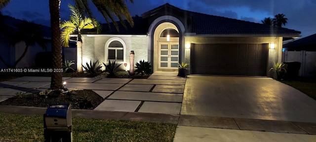 view of front of property with a garage