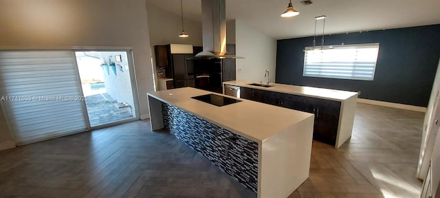 kitchen featuring parquet floors, a center island, pendant lighting, island range hood, and black electric stovetop