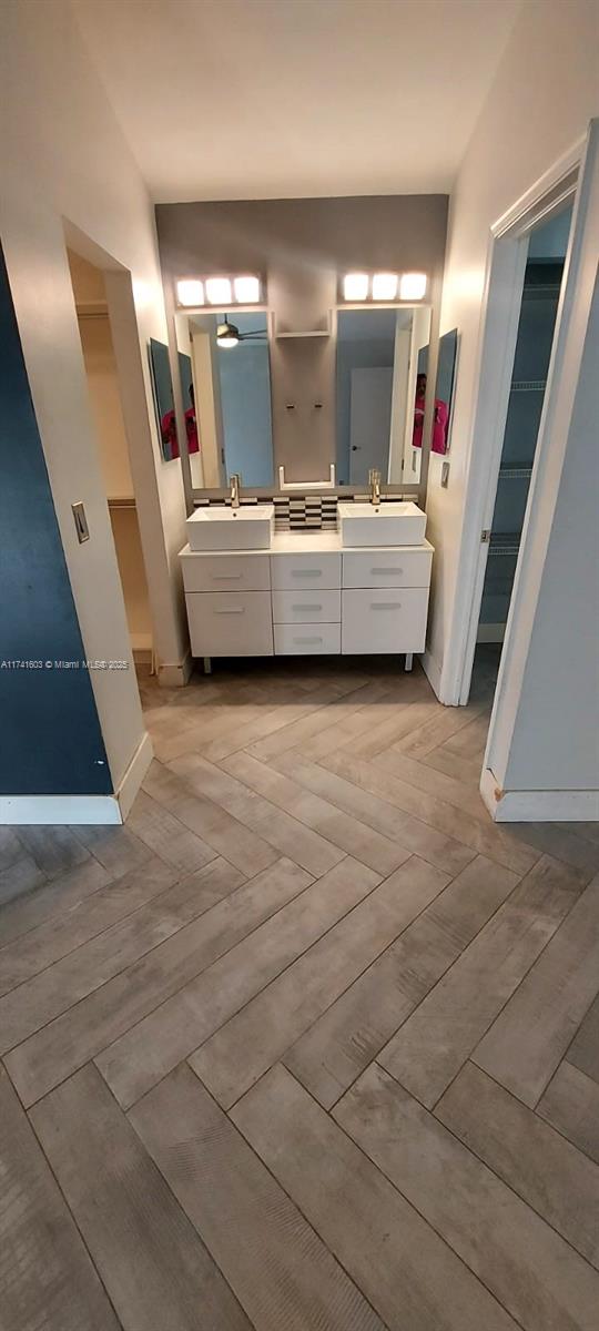 bathroom featuring hardwood / wood-style flooring and vanity