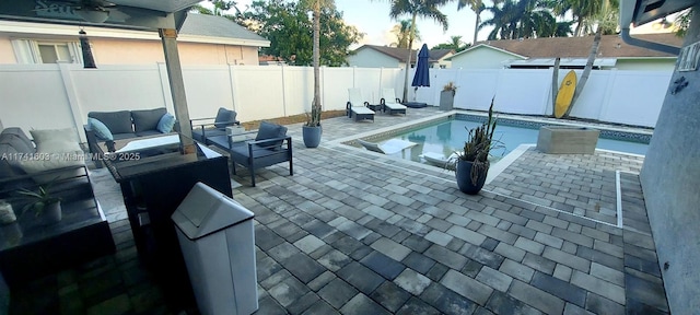 view of swimming pool with a patio and an outdoor hangout area