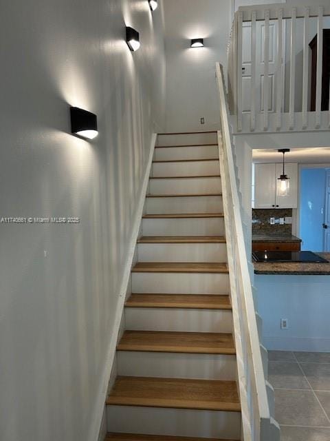 staircase with tile patterned flooring