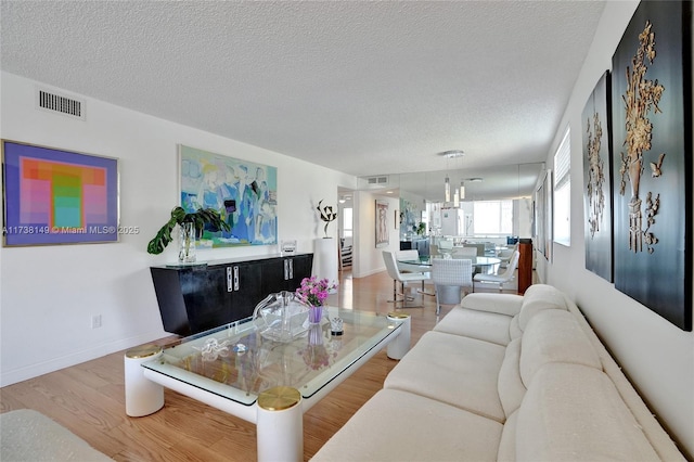 7368 Devon Dr Unit 301, Tamarac, FL 33321 - living room with hardwood / wood-style floors and a textured ceiling