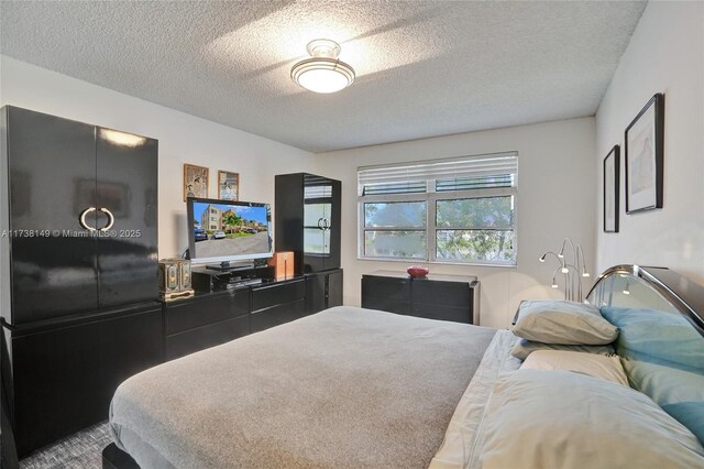7368 Devon Dr Unit 301, Tamarac, FL 33321 - bedroom with a textured ceiling
