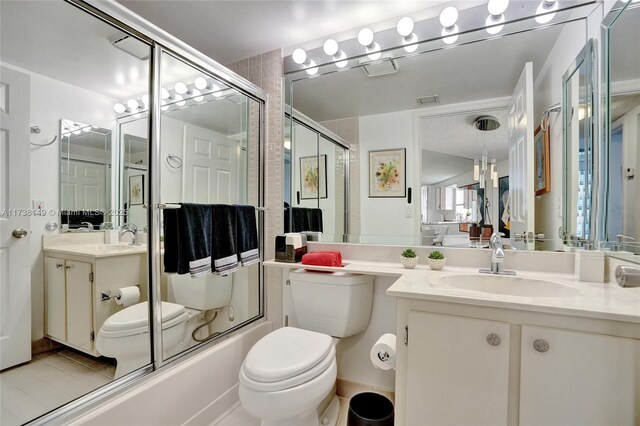 7368 Devon Dr Unit 301, Tamarac, FL 33321 - full bathroom featuring vanity, bath / shower combo with glass door, and toilet