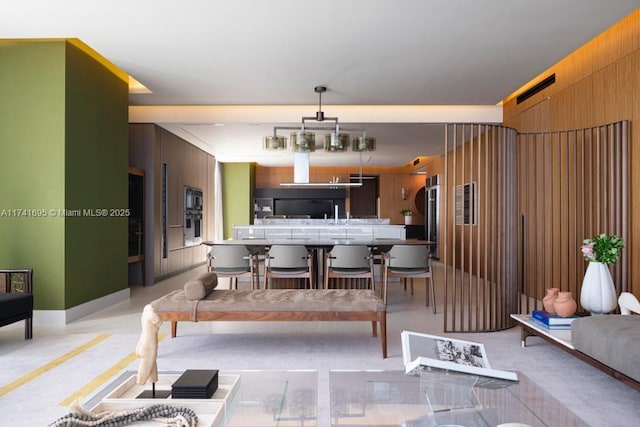 dining room with wooden walls