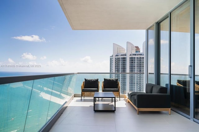 balcony featuring a view of city and an outdoor hangout area