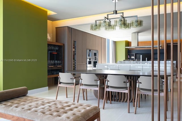 kitchen with a sink and stainless steel double oven