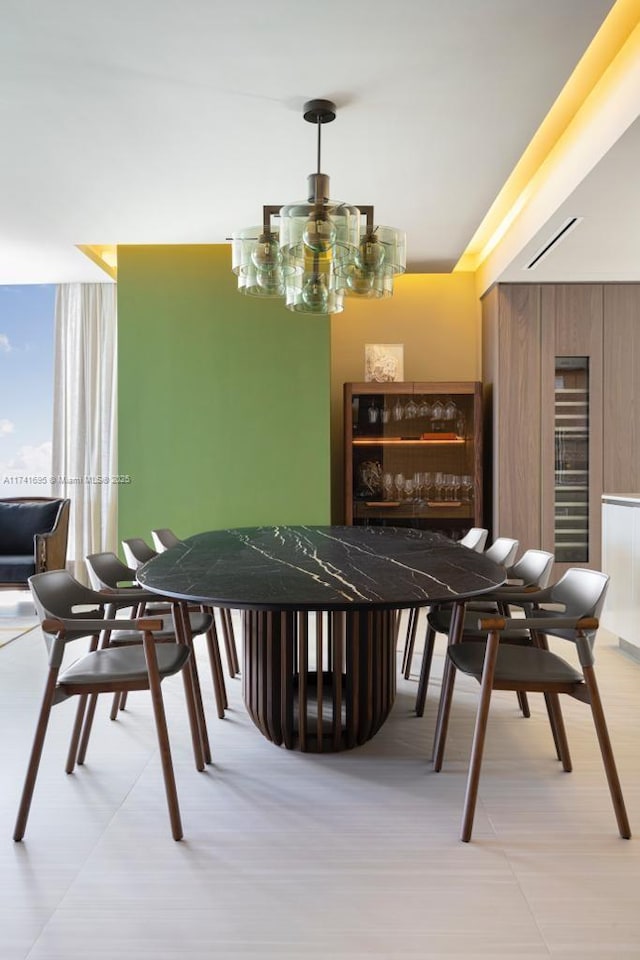 bar with a notable chandelier and wood walls