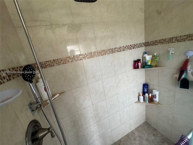 bathroom with tiled shower