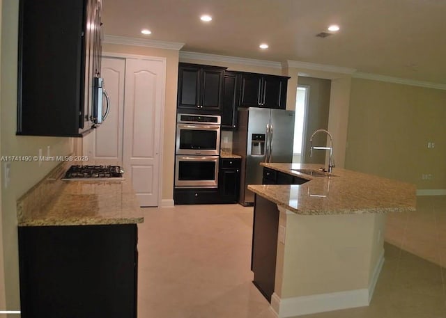 kitchen featuring sink, a center island with sink, and appliances with stainless steel finishes