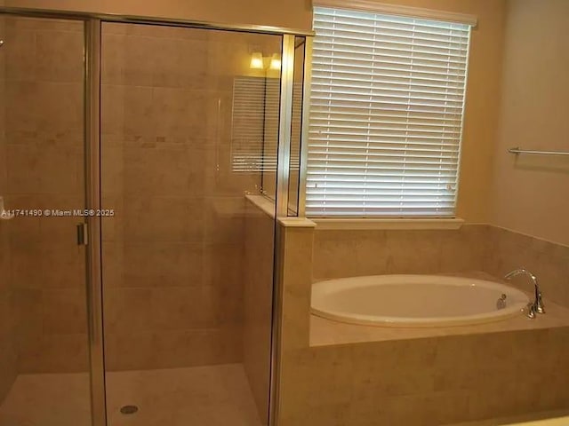 bathroom featuring plus walk in shower