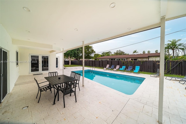 view of swimming pool featuring a patio area