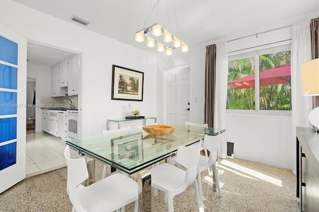 dining space featuring sink