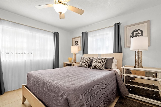 tiled bedroom with ceiling fan