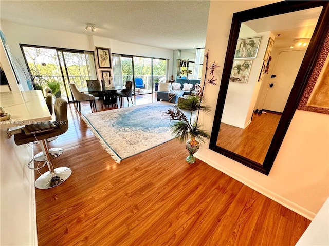 3850 Washington St Unit 317, Hollywood, FL 33021 - living room with hardwood / wood-style floors and a textured ceiling