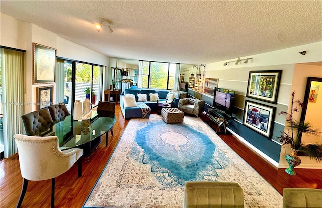 3850 Washington St Unit 317, Hollywood, FL 33021 - living room featuring dark wood-type flooring and a textured ceiling