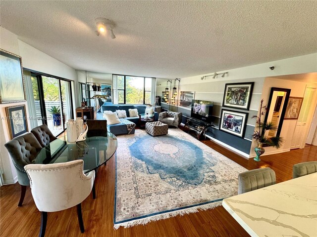 3850 Washington St Unit 317, Hollywood, FL 33021 - living room with hardwood / wood-style floors and a textured ceiling