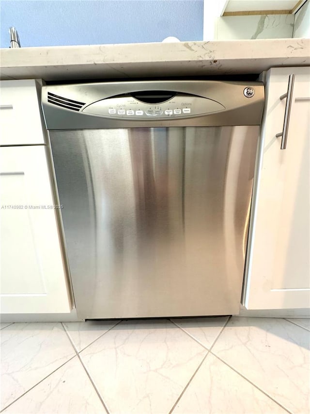 3850 Washington St Unit 317, Hollywood, FL 33021 - room details featuring stainless steel dishwasher and white cabinets