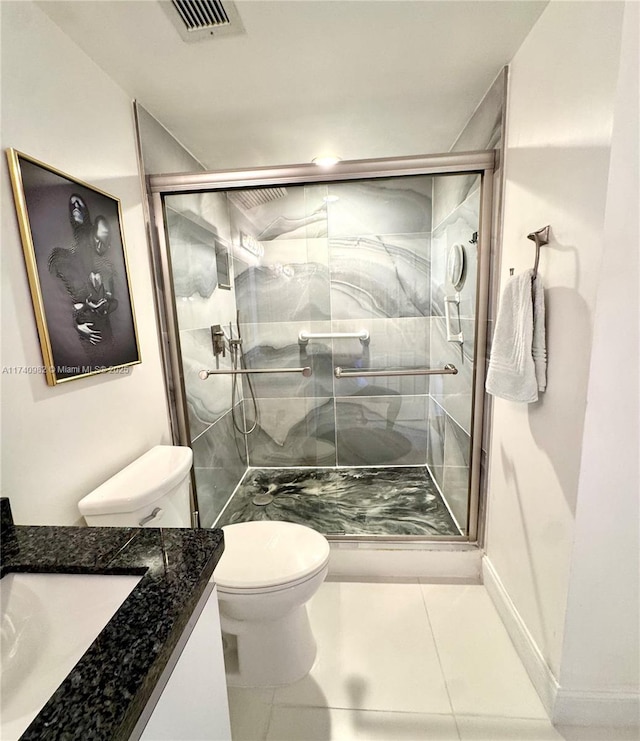 3850 Washington St Unit 317, Hollywood, FL 33021 - bathroom with vanity, an enclosed shower, tile patterned floors, and toilet