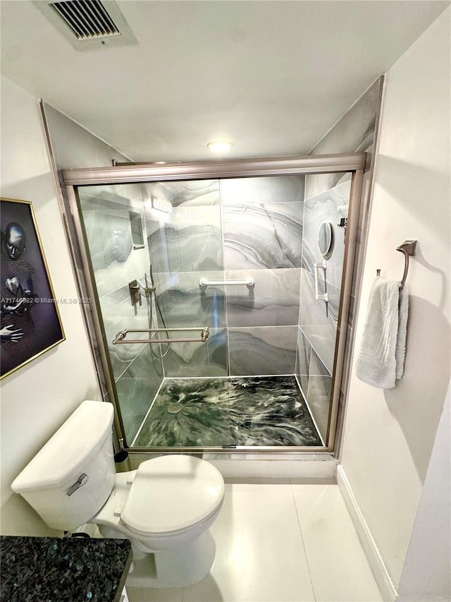 3850 Washington St Unit 317, Hollywood, FL 33021 - bathroom with tile patterned flooring, a shower with shower door, and toilet